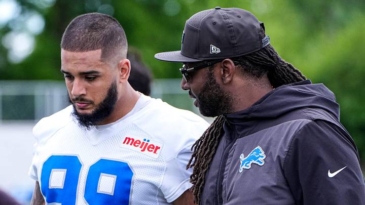 Detroit Lions defensive end Ahmed Hassanein (99), left, talks to defensive coordinator Kelvin Sheppard after practice during mini camp at Meijer Performance Center in Allen Park on Tuesday, June 16, 2026.