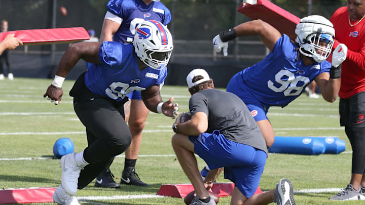 Bills defensive tackles Larry Ogunjobi and Deone Walker explode off the line during drills during the second day of Buffalo Bills training camp at St. John Fisher University Thursday, July 24, 2025 in Pittsford.