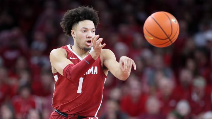 Jan 11, 2023; Fayetteville, Arkansas, USA; Alabama Crimson Tide guard Mark Sears (1) passes in the second half against the Arkansas Razorbacks at Bud Walton Arena. Alabama won 84-69. Mandatory Credit: Nelson Chenault-USA TODAY Sports