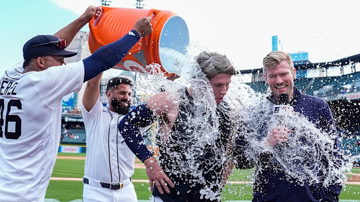 Detroit Tigers right fielder Wenceel Pérez (46), left, and second baseman Gleyber Torres (25) give a Gatorade bath to second baseman Colt Keith (33) to celebrate his walk-off single against Kansas City Royals to win the game 10-9 at Comerica Park in Detroit on Thursday, April 16, 2026.