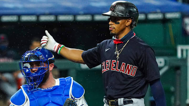 Aug 31, 2020; Kansas City, Missouri, USA; Cleveland Indians shortstop Francisco Lindor (12) taps Kansas City Royals catcher Cam Gallagher (36) on the head during the fourth inning at Kauffman Stadium. Mandatory Credit: Jay Biggerstaff-USA TODAY Sports
