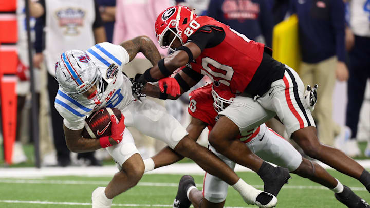 Jan 1, 2026; New Orleans, LA, USA; Georgia Bulldogs linebacker Justin Williams (19) and defensive back Jacorey Thomas (20) tackles Mississippi Rebels wide receiver Harrison Wallace III (2) in the first quarter during the 2026 Sugar Bowl and quarterfinal game of the College Football Playoff at Caesars Superdome. Mandatory Credit: Stephen Lew-Imagn Images Jan 1, 2026; New Orleans, LA, USA; Georgia Bulldogs linebacker Justin Williams (19) and defensive back Jacorey Thomas (20) tackles Mississippi Rebels wide receiver Harrison Wallace III (2) in the first quarter during the 2026 Sugar Bowl and quarterfinal game of the College Football Playoff at Caesars Superdome. Mandatory Credit: Stephen Lew-Imagn Images