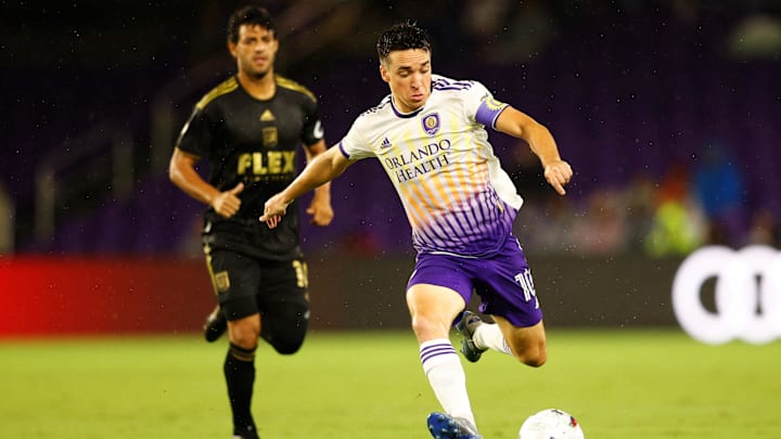 Apr 2, 2022; Orlando, Florida, USA;  Orlando City midfielder Mauricio Pereyra (10) looks to shoot