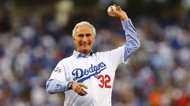 Nov 1, 2017; Los Angeles, CA, USA; Los Angeles Dodgers former pitcher Sandy Koufax throws out the ceremonial first pitch before game seven of the 2017 World Series against the Houston Astros at Dodger Stadium. Mandatory Credit: Tim Bradbury/Pool Photo via Imagn Images