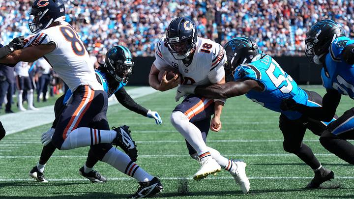 Bears quarterback Caleb Williams pounds the ball for the goal line at Charlotte against the Carolina Panthers defense,