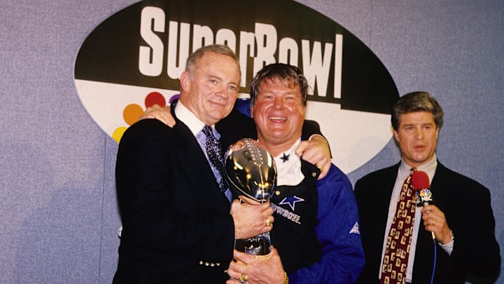 Dallas Cowboys owner Jerry Jones and head coach Jimmy Johnson with the Lombardi trophy after defeating the Buffalo Bills during Super Bowl XXVIII.