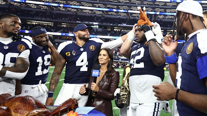 Dallas Cowboys quarterback Dak Prescott and teammates celebrate with a turkey after beating the Kansas City Chiefs 