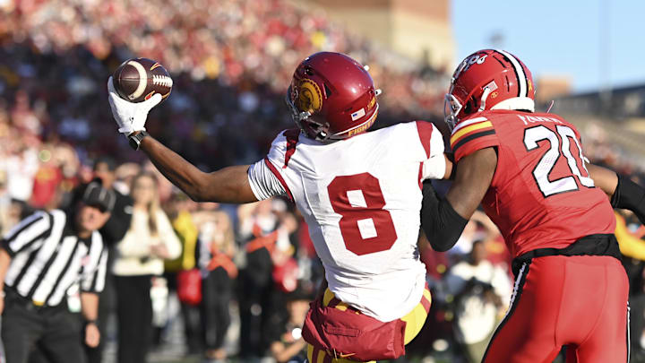 Oct 19, 2024; College Park, Maryland, USA; Southern California Trojans wide receiver Ja'Kobi Lane (8) catches one handed pass for a touchdown as Maryland Terrapins defensive back Perry Fisher (20) defends during the first half at SECU Stadium. Mandatory Credit: Tommy Gilligan-Imagn Images Oct 19, 2024; College Park, Maryland, USA; Southern California Trojans wide receiver Ja'Kobi Lane (8) catches one handed pass for a touchdown as Maryland Terrapins defensive back Perry Fisher (20) defends during the first half at SECU Stadium. Mandatory Credit: Tommy Gilligan-Imagn Images