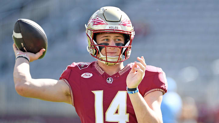 Nov 2, 2024; Tallahassee, Florida, USA;  Florida State Seminoles quarterback Luke Kromenhoek (14) warms up before a game against the North Carolina Tarheels at Doak S. Campbell Stadium. Mandatory Credit: Robert Myers-Imagn Images