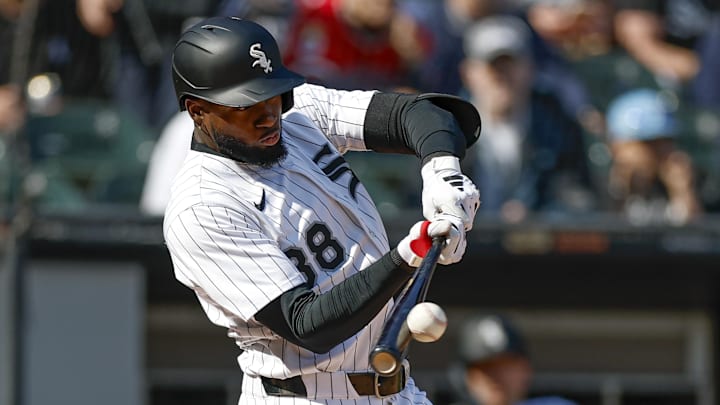 Chicago White Sox center fielder Luis Robert Jr. (88) doubles against the Texas Rangers at Rate Field. Chicago White Sox center fielder Luis Robert Jr. (88) doubles against the Texas Rangers at Rate Field.