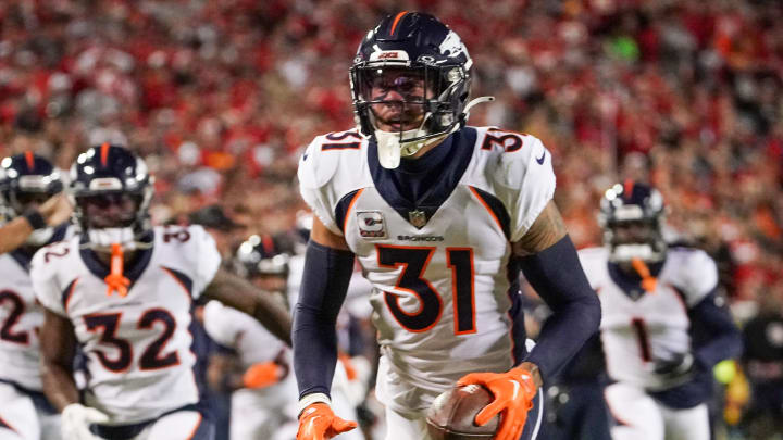 Oct 12, 2023; Kansas City, Missouri, USA; Denver Broncos safety Justin Simmons (31) celebrates after making an interception against the Kansas City Chiefs during the first half at GEHA Field at Arrowhead Stadium.