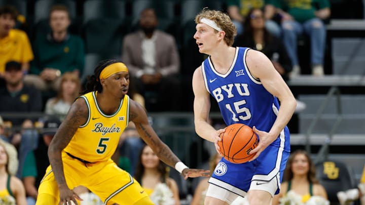 Feb 10, 2026; Waco, Texas, USA; BYU Cougars guard Richie Saunders (15) looks to pass against Baylor Bears guard Obi Agbim (5) during the first half at Paul and Alejandra Foster Pavilion. Mandatory Credit: Chris Jones-Imagn Images Feb 10, 2026; Waco, Texas, USA; BYU Cougars guard Richie Saunders (15) looks to pass against Baylor Bears guard Obi Agbim (5) during the first half at Paul and Alejandra Foster Pavilion. Mandatory Credit: Chris Jones-Imagn Images