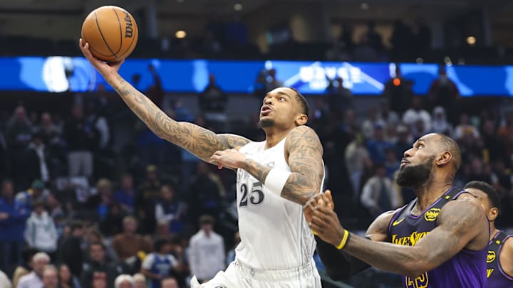 Jan 7, 2025; Dallas, Texas, USA;  Dallas Mavericks forward P.J. Washington (25) shoots past Los Angeles Lakers forward LeBron James (23) during the first quarter at American Airlines Center. Mandatory Credit: Kevin Jairaj-Imagn Images