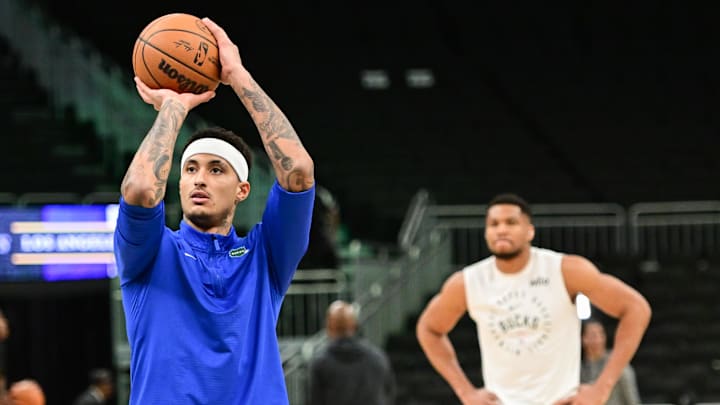 Mar 13, 2025; Milwaukee, Wisconsin, USA;  Milwaukee Bucks forward Kyle Kuzma (18) warms up with forward Giannis Antetokounmpo (34) before a game against the Los Angeles Lakers at Fiserv Forum. Mandatory Credit: Benny Sieu-Imagn Images