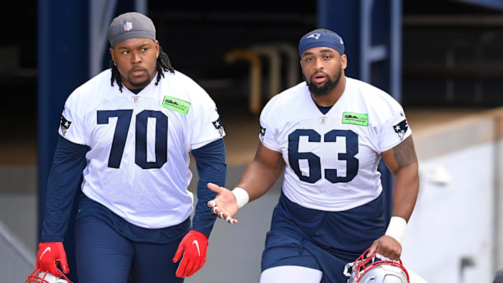 May 11, 2024; Foxborough, MA, USA; New England Patriots offensive tackle Caedan Wallace (70) and guard Layden Robinson (63) arrive at practice at the New England Patriots rookie camp at Gillette Stadium.