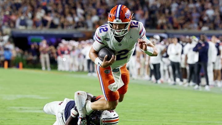 Sep 19, 2026; Auburn, Alabama, USA; Auburn Tigers defensive back Kaleb Harris (8) tackled Florida Gators quarterback Aaron Philo (12) during the third quarter at Jordan-Hare Stadium. Mandatory Credit: John Reed-Imagn Images Sep 19, 2026; Auburn, Alabama, USA; Auburn Tigers defensive back Kaleb Harris (8) tackled Florida Gators quarterback Aaron Philo (12) during the third quarter at Jordan-Hare Stadium. Mandatory Credit: John Reed-Imagn Images