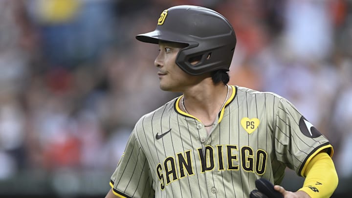 Jul 26, 2024; Baltimore, Maryland, USA;  San Diego Padres shortstop Ha-Seong Kim (7) walks to the dugout during the game against the Baltimore Orioles at Oriole Park at Camden Yards