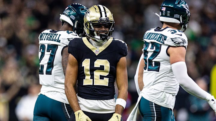 Sep 22, 2024; New Orleans, Louisiana, USA; New Orleans Saints wide receiver Chris Olave (12) reacts to making a first down reception against Philadelphia Eagles safety Reed Blankenship (32) during the first half at Caesars Superdome. Mandatory Credit: Stephen Lew-Imagn Images Sep 22, 2024; New Orleans, Louisiana, USA; New Orleans Saints wide receiver Chris Olave (12) reacts to making a first down reception against Philadelphia Eagles safety Reed Blankenship (32) during the first half at Caesars Superdome. Mandatory Credit: Stephen Lew-Imagn Images