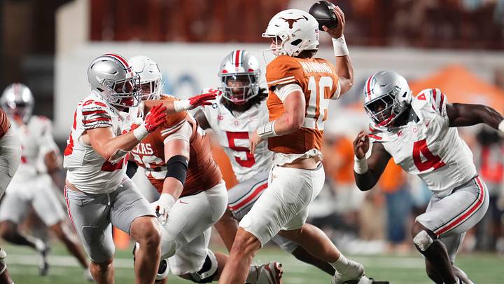 Texas Longhorns quarterback Arch Manning (16) looks to throw over Ohio State Buckeyes linebacker Payton Pierce (26) during the NCAA football game at Darrell K Royal–Texas Memorial Stadium in Austin, Texas on Sept. 12, 2026. Texas won 24-23.