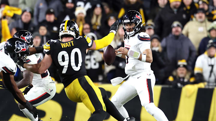 Jan 12, 2026; Pittsburgh, PA, USA; Houston Texans quarterback C.J. Stroud (7) scrambles against Pittsburgh Steelers linebacker T.J. Watt (90) during the second half of an AFC Wild Card Round game at Acrisure Stadium. Mandatory Credit: Charles LeClaire-Imagn Images Jan 12, 2026; Pittsburgh, PA, USA; Houston Texans quarterback C.J. Stroud (7) scrambles against Pittsburgh Steelers linebacker T.J. Watt (90) during the second half of an AFC Wild Card Round game at Acrisure Stadium. Mandatory Credit: Charles LeClaire-Imagn Images