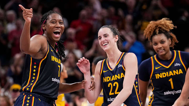 Indiana Fever forward Aliyah Boston celebrates with Indiana Fever guard Caitlin Clark recording a triple-double.