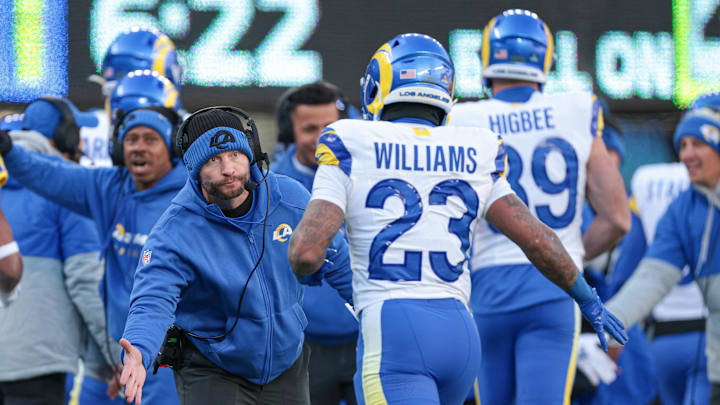 Dec 22, 2024; East Rutherford, New Jersey, USA; Los Angeles Rams head coach Sean McVay celebrates with running back Kyren Williams (23) after a rushing touchdown during the first half against the New York Jets at MetLife Stadium. Mandatory Credit: Vincent Carchietta-Imagn Images
