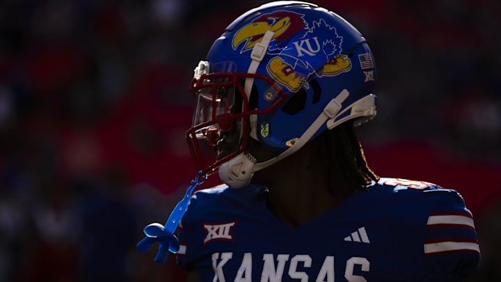 Nov 23, 2024; Kansas City, Missouri, USA;  Kansas linebacker Jon Jon Kamara (33) during warms up during pregame prior to the game between the Kansas Jayhawks and the Colorado Buffaloes at GEHA Field at Arrowhead Stadium. Mandatory Credit: Nick Tre. Smith-Imagn Images