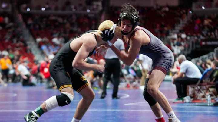 Southeast Polk's Justis Jesuroga (left) is one of 13 who advanced to the quarterfinals for the Rams.