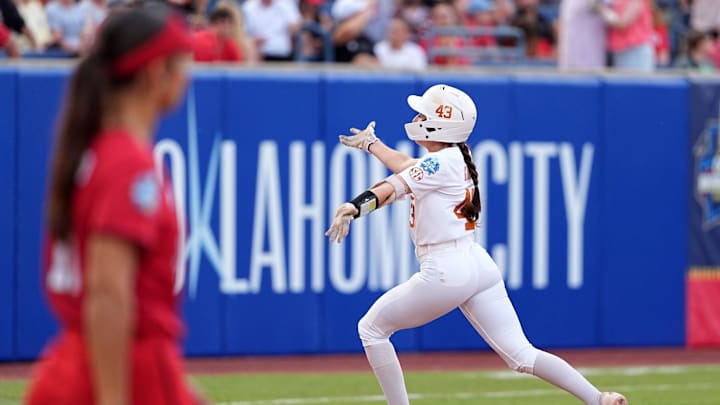 Texas' Leighann Goode (43) celebrates a home run in the first inning during the Women's College World Series championship game between Texas Tech and Texas at Devon Park, Friday, June, 6, 2025, in Oklahoma City.