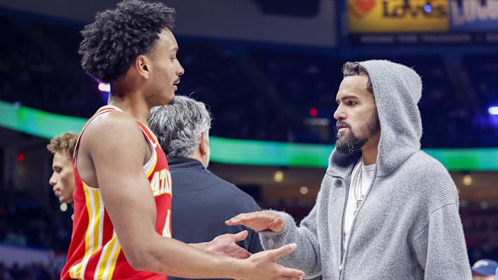 Kobe Bufkin #4 and Trae Young #11 of the Atlanta Hawks