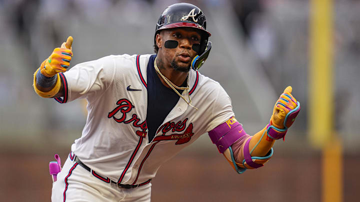 Jun 18, 2025; Cumberland, Georgia, USA; Atlanta Braves right fielder Ronald Acuna Jr (13) reacts after hitting a lead off home run against the New York Mets during the first inning at Truist Park. Mandatory Credit: Dale Zanine-Imagn Images