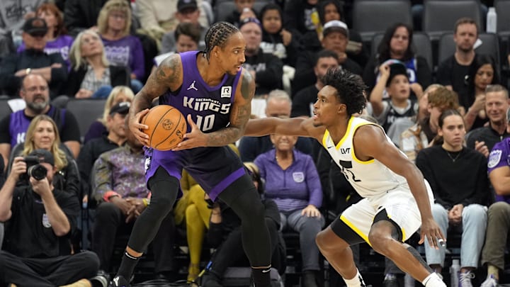 Dec 8, 2024; Sacramento, California, USA; Sacramento Kings forward DeMar DeRozan (10) handles the ball against Utah Jazz guard Collin Sexton (2) during the third quarter at Golden 1 Center. Mandatory Credit: Darren Yamashita-Imagn Images