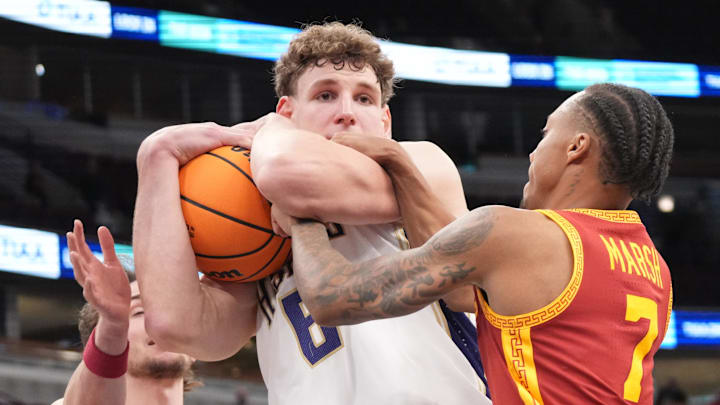 Mar 11, 2026; Chicago, IL, USA; Washington Huskies forward Hannes Steinbach (6) and Southern California Trojans guard Jordan Marsh (7) go for the ball during the overtime at United Center. Mandatory Credit: David Banks-Imagn Images