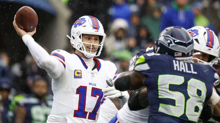 Oct 27, 2024; Seattle, Washington, USA; Buffalo Bills quarterback Josh Allen (17) passes against the Seattle Seahawks during the second quarter at Lumen Field. Mandatory Credit: Joe Nicholson-Imagn Images