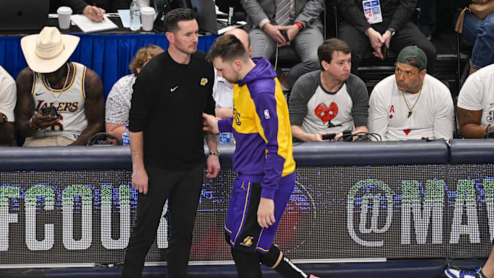 Apr 9, 2025; Dallas, Texas, USA; Los Angeles Lakers head coach JJ Redick and guard Luka Doncic (77) during the game between the Dallas Mavericks and the Los Angeles Lakers at American Airlines Center. Mandatory Credit: Jerome Miron-Imagn Images