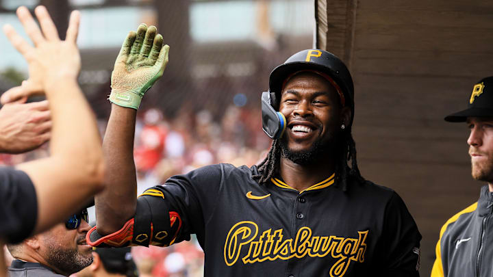 Sep 22, 2024; Cincinnati, Ohio, USA; Pittsburgh Pirates outfielder Oneil Cruz (15) high fives teammates after hitting a solo home run in the first inning against the Cincinnati at Great American Ball Park. Mandatory Credit: Katie Stratman-Imagn Images