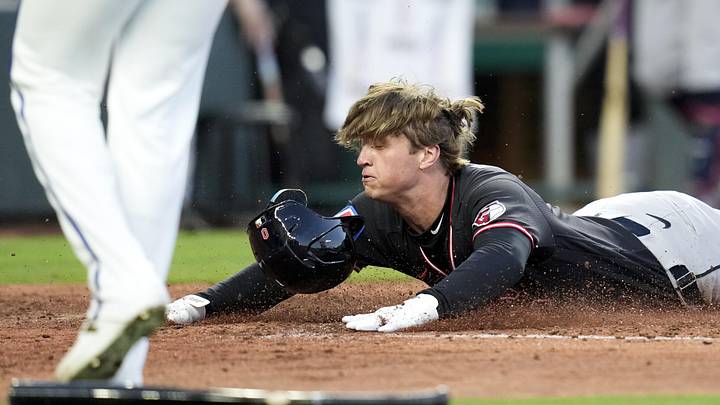 May 6, 2026: Cleveland Guardians center fielder Petey Halpin (0) slides into home plate to score a run during the fifth inning against the Kansas City Royals at Kauffman Stadium. 