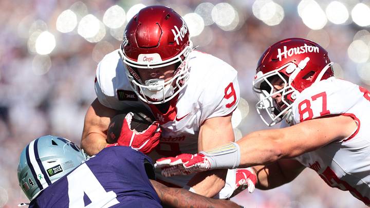 Houston Cougars tight end Patrick Overmyer (9) looks to gain yards before a tackle by Kansas State Wildcats linebacker Mekhi Mason (4) during the game inside Bill Snyder Family Stadium in Manhattan, Kansas, on Oct. 10, 2026. Houston Cougars tight end Patrick Overmyer (9) looks to gain yards before a tackle by Kansas State Wildcats linebacker Mekhi Mason (4) during the game inside Bill Snyder Family Stadium in Manhattan, Kansas, on Oct. 10, 2026.