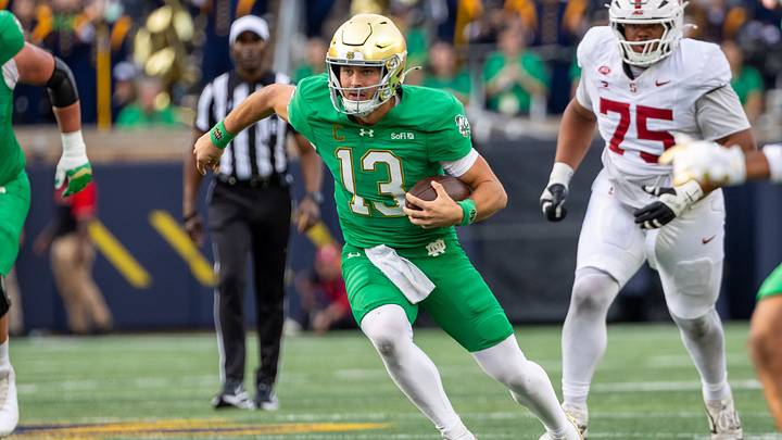 Oct 10, 2026; South Bend, Indiana, USA; Notre Dame Fighting Irish quarterback CJ Carr (13) runs the ball against the Stanford Cardinal during the second half at Notre Dame Stadium. Mandatory Credit: Michael Caterina-Imagn Images Oct 10, 2026; South Bend, Indiana, USA; Notre Dame Fighting Irish quarterback CJ Carr (13) runs the ball against the Stanford Cardinal during the second half at Notre Dame Stadium. Mandatory Credit: Michael Caterina-Imagn Images