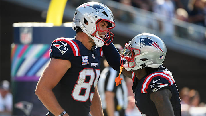 Sep 28, 2025; Foxborough, Massachusetts, USA; New England Patriots tight end Hunter Henry (85) reacts with wide receiver Stefon Diggs (8) after scoring a touchdown during the second half at Gillette Stadium. Mandatory Credit: Bob DeChiara-Imagn Images