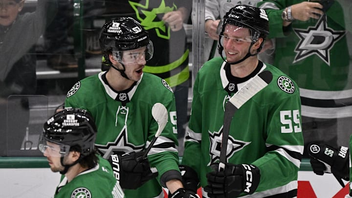 Jan 4, 2025; Dallas, Texas, USA; Dallas Stars center Wyatt Johnston (53) and defenseman Thomas Harley (55) celebrate on the ice after the Stars defeat the Utah Hockey Club in the overtime period at the American Airlines Center. Mandatory Credit: Jerome Miron-Imagn Images