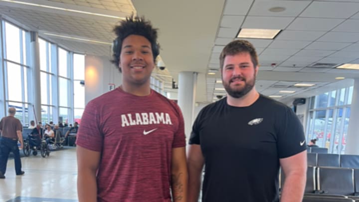 Michael Carroll (left) with former Alabama lineman Landon Dickerson.