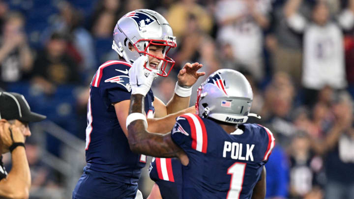 Aug 15, 2024; Foxborough, Massachusetts, USA; New England Patriots quarterback Drake Maye (10) celebrates with wide receiver Ja'Lynn Polk (1) after scoring a touchdown against the Philadelphia Eagles during the first half at Gillette Stadium. Mandatory Credit: Brian Fluharty-USA TODAY Sports
