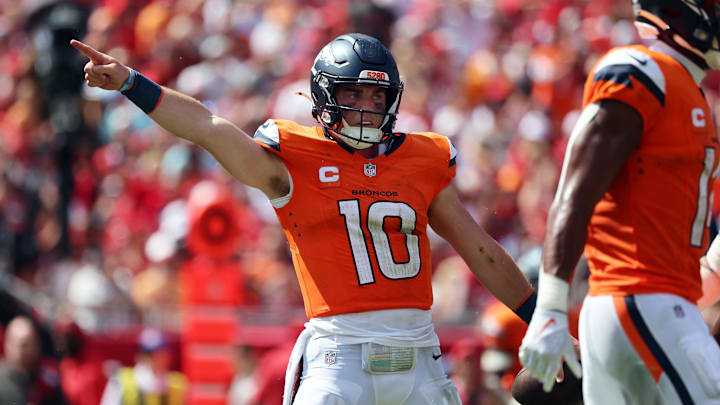 Sep 22, 2024; Tampa, Florida, USA; Denver Broncos quarterback Bo Nix (10) reacts after he gets first down against the Tampa Bay Buccaneers during the second half at Raymond James Stadium. Mandatory Credit: Kim Klement Neitzel-Imagn Images