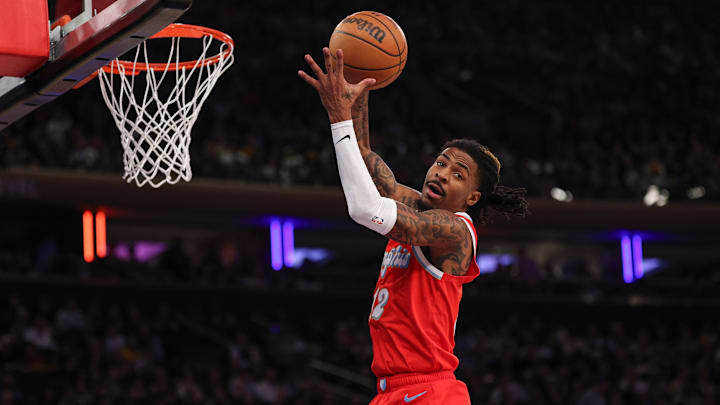 Jan 27, 2025; New York, New York, USA; Memphis Grizzlies guard Ja Morant (12) rebounds during the second half against the New York Knicks at Madison Square Garden. Mandatory Credit: Vincent Carchietta-Imagn Images