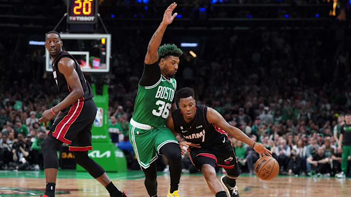 May 29, 2023; Boston, Massachusetts, USA; Miami Heat guard Kyle Lowry (7) controls the ball against Boston Celtics guard Marcus Smart (36) in the second quarter during game seven of the Eastern Conference Finals for the 2023 NBA playoffs at TD Garden. Mandatory Credit: David Butler II-Imagn Images