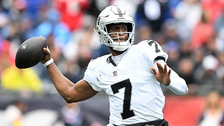Las Vegas Raiders quarterback Geno Smith (7) drops back to pass against the New England Patriots during the first half at Gillette Stadium.