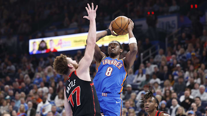 Feb 7, 2025; Oklahoma City, Oklahoma, USA; Oklahoma City Thunder forward Jalen Williams (8) shoots as Toronto Raptors forward Garrett Temple (17) defends during the second quarter at Paycom Center. Mandatory Credit: Alonzo Adams-Imagn Images