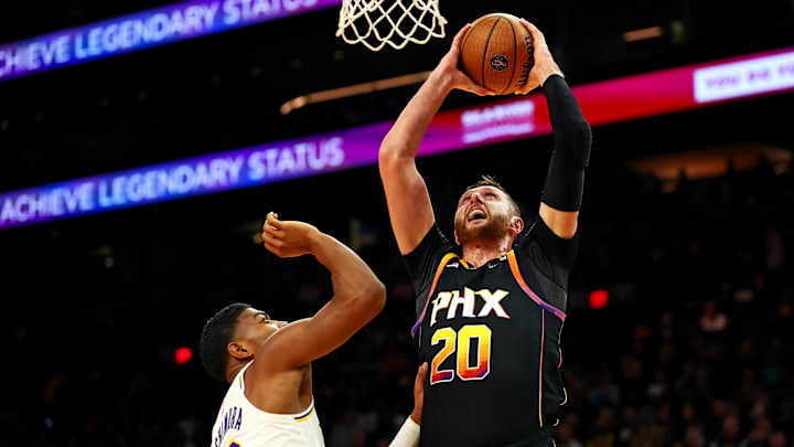 Nov 26, 2024; Phoenix, Arizona, USA; Phoenix Suns center Jusuf Nurkic (20) drives to the basket against Los Angeles Lakers forward Rui Hachimura (28) during the third quarter at Footprint Center. Mandatory Credit: Mark J. Rebilas-Imagn Images