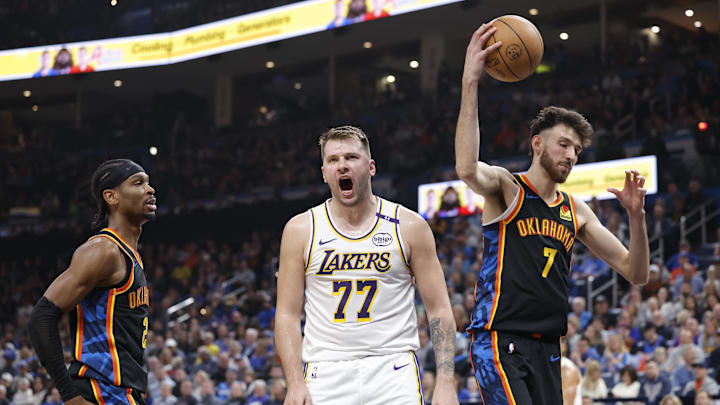 Apr 6, 2025; Oklahoma City, Oklahoma, USA; Los Angeles Lakers guard Luka Doncic (77) yells after scoring against the Oklahoma City Thunder during the second quarter at Paycom Center. Mandatory Credit: Alonzo Adams-Imagn Images